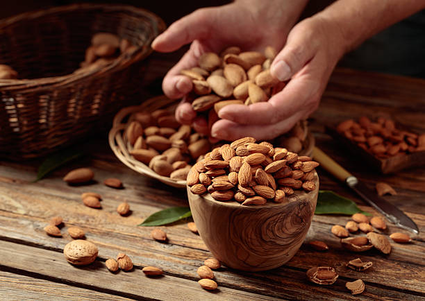 istock Almond nuts on a wooden table. 2229344551