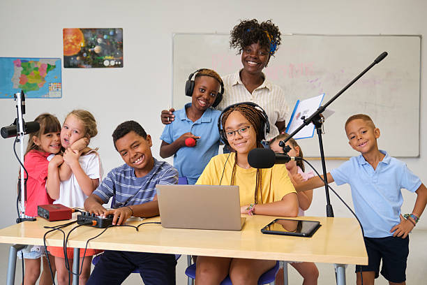 istock Diverse group of elementary school students recording a podcast with their teacher 2229345454