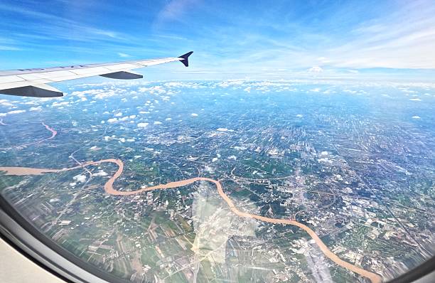 a view from airplane window thailand clouds high above