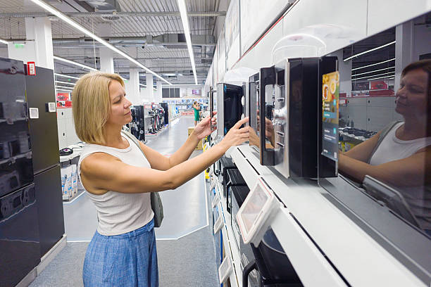 istock Woman chooses household appliances 2229345709