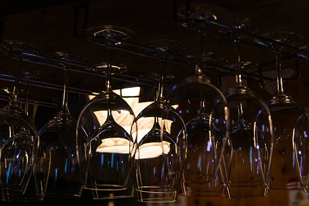 istock wine glass hanging in the bar 2229345908