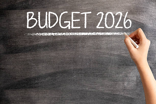 istock Budget 2026 on Blackboard with Woman Hand 2229347024