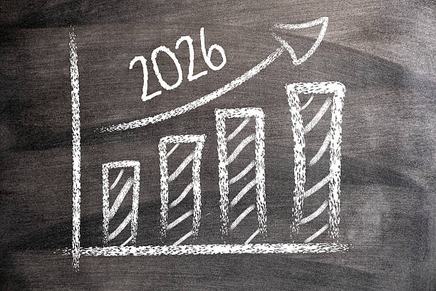 istock 2026 with Rising Arrow and Bar Graph on Blackboard 2229347099