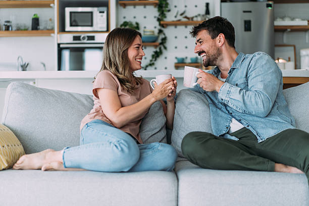 istock Lovely young couple drinking coffee at home. 2229347194