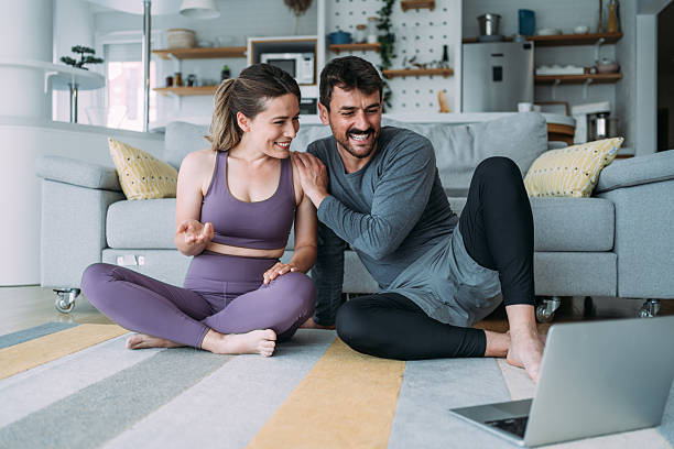 istock Couple exercising together at home. 2229347225