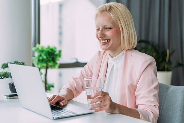istock Successful businesswoman in modern office working on laptop. 2229347254