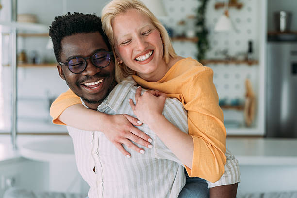 istock Young happy couple piggybacking at home. 2229347306
