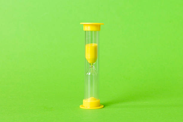 istock hourglass on the table, sand clock as time passing concept for business deadline, copy space 2229351328