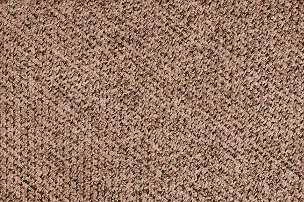 Macro photo of brown woven textile fabric, upholstery material, cloth with detailed texture and pattern. Perfect for textile design, background, backdrop, wallpaper