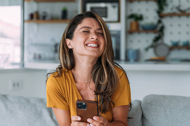 istock Woman using smartphone at home. 2229356641
