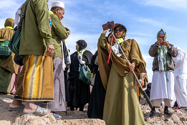 Medina, Saudi Arabia - December 18, 2024: Pilgrims over the Archers Hill Uhud, in front of the Mosque of the Leader of the Martyrs, Medina, Saudi Arabia, sacred site for all the Muslim world