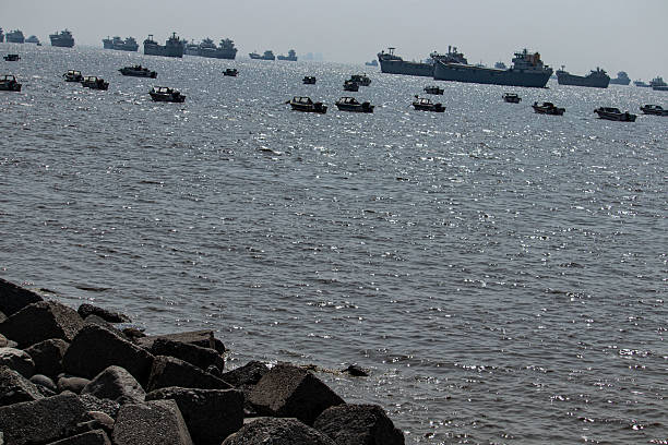 istock Seaside view of moving cargo ship at Patenga beach. 2229358867