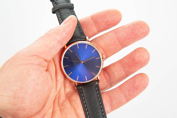 istock Wristwatch in hand on a white background 2229359521
