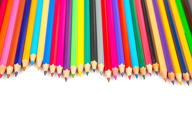 istock Sharpened colored pencils in a variety of hues lined up on a white backdrop. Suitable for artistic tools, school essentials, or creative project stock photos. 2229359922