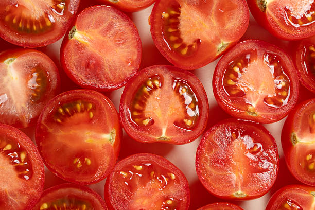 istock Halved Ripe Cherry Tomatoes Macro Top View. Natural Food Texture. 2229359998
