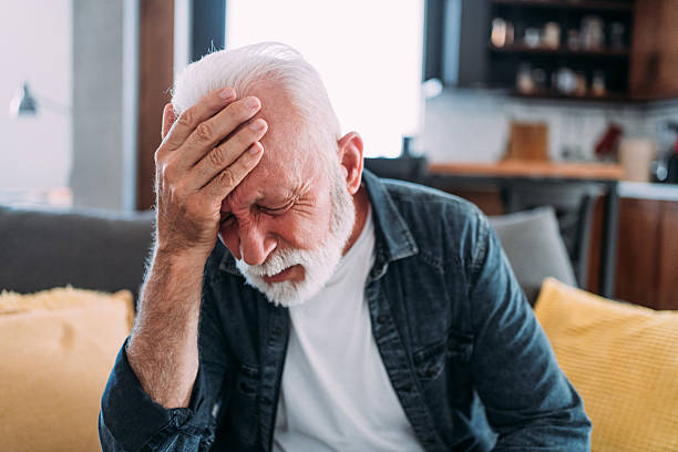 istock Senior man suffering with a migraine. 2229361130