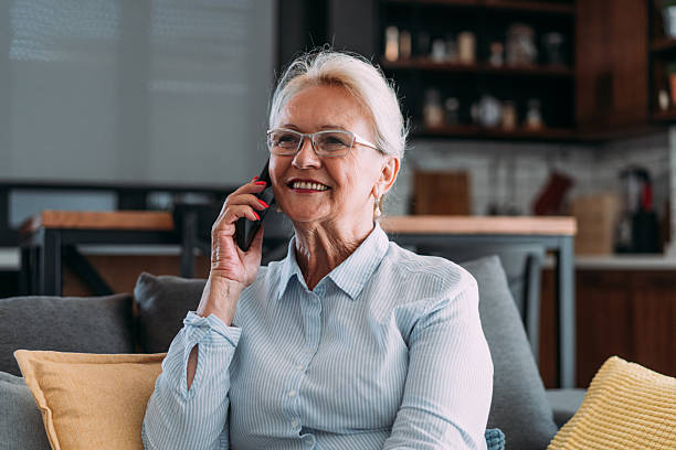 istock Woman talking on mobile phone at home. 2229361155