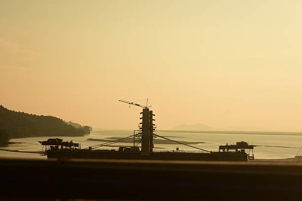 crane in sunset at sea side