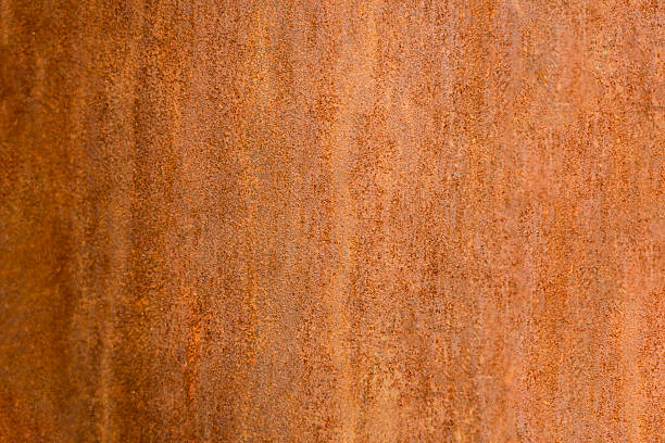 Close-up view of a rusty metal surface, showcasing a textured background with varying shades of brown and orange. The patina displays a unique and weathered appearance.