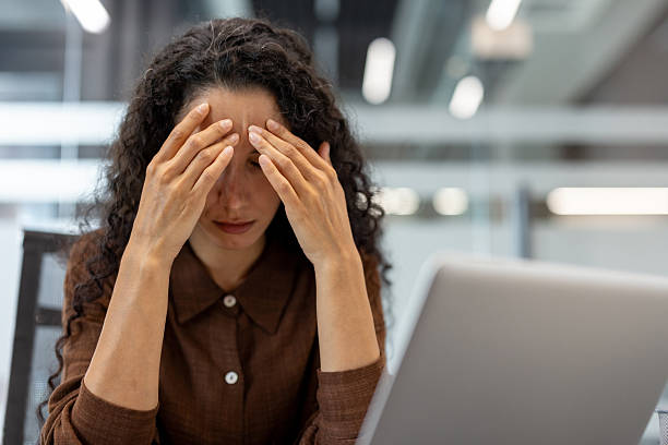 istock Stressed woman in office, feeling frustrated with work. 2229365584