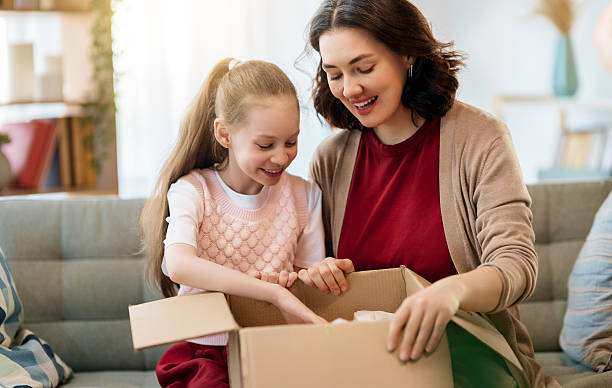 istock Mother and daughter are unpacking cardboard 2229366794