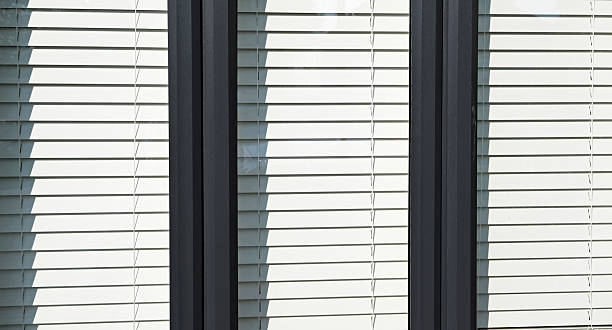 istock Closed double glazed window exterior with sun blind. Sunny summer day 2229368651