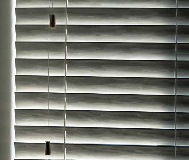 istock Closed double glazed window interior with backlit sun blind. Sunny summer day 2229368662
