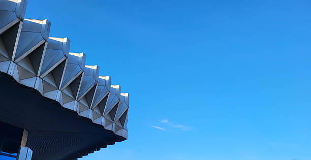istock A roof fragment with corners against a blue sky. 2229375747