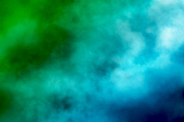 istock Green and blue mixing smoke creating abstract background texture 2229376369