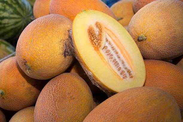 istock Sliced yellow melon with seeds on market 2229376443