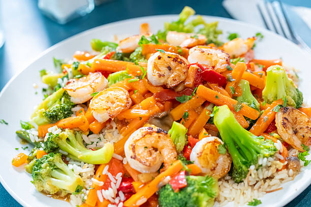 shrimp_stir_fry served over fried rice and veggies