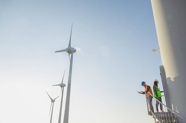 istock Engineers Inspecting Wind Turbine Tower Stairs at a Modern Renewable Energy Facility 2229378335
