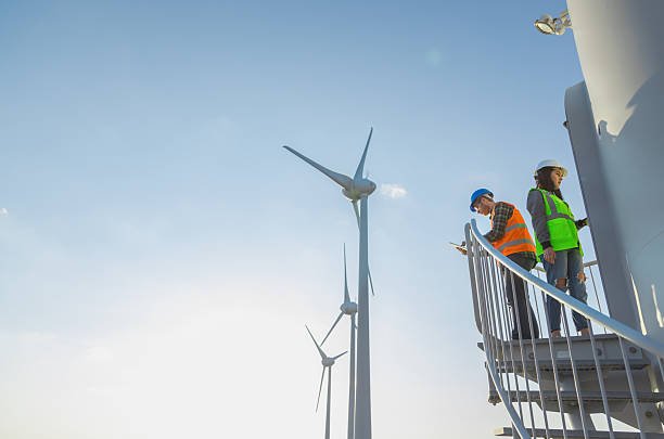 istock Engineers Inspecting Wind Turbine Tower Stairs at a Modern Renewable Energy Facility 2229378528