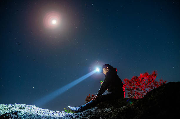 istock Exploring alone on the mountain top under the starry sky 2229380173