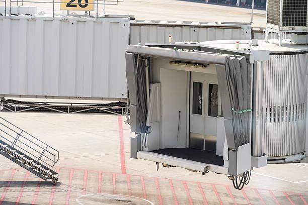 This is a jet bridge. It is a movable enclosed walkway that connects the airport terminal directly to the door of an aircraft.