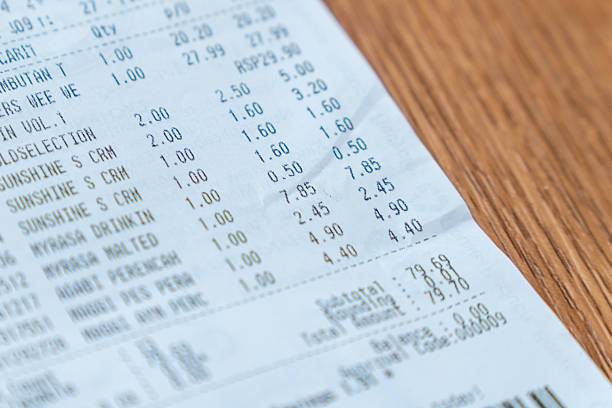 istock Printed grocery receipt on a wooden table. 2229382138