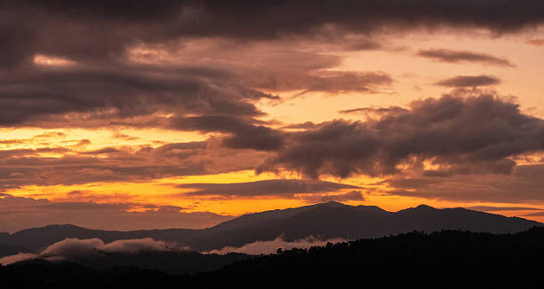 istock Golden sky sunrise dramatic beautiful landscape view. Dawn sky gold dusk time cloudscape with sunlight. Dramatic sunset scenic landscape. Beautiful landscape sunshine nature 2229382342