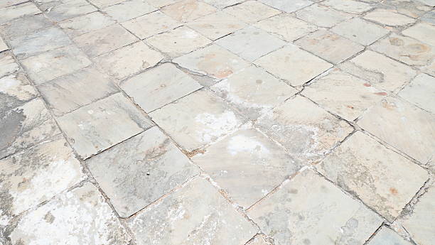 istock Old weathered stone tiles texture with natural pattern and cracks 2229384008