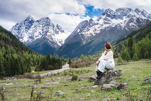 istock Woman exploring Siguniangshan mountains in Sichuan, China during Summer 2229384426