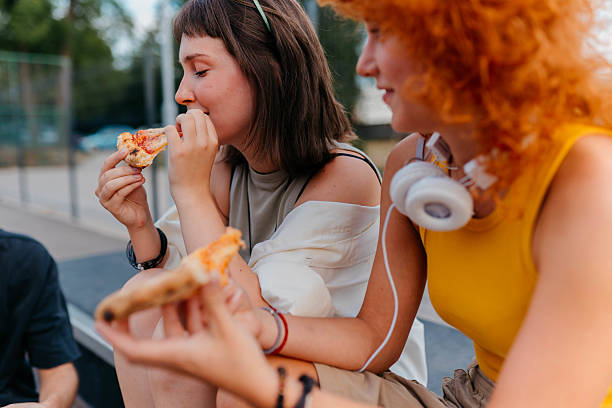 istock Eating pizza in the park 2229387548