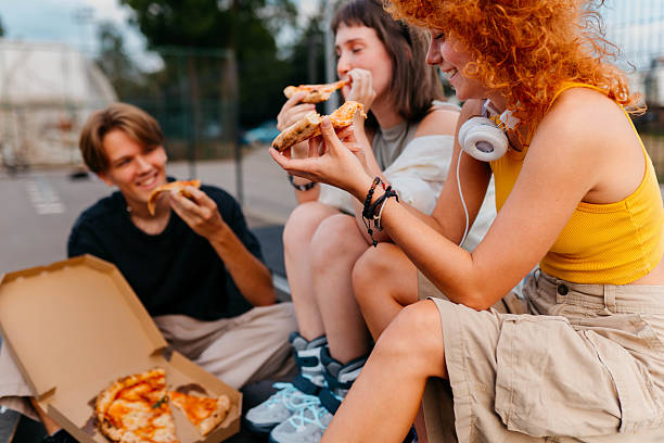 istock Eating pizza in the park 2229387553