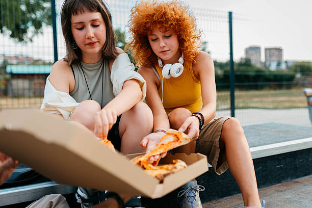 istock Eating pizza in the park 2229387561