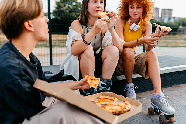 istock Eating pizza in the park 2229387565