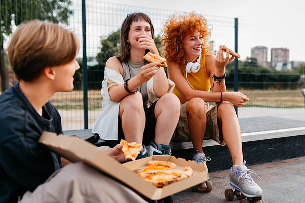 Eating pizza in the park