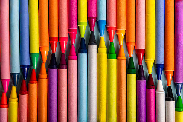 istock Rows of Colorful Crayons in an Organzied Pattern Layout 2229390885