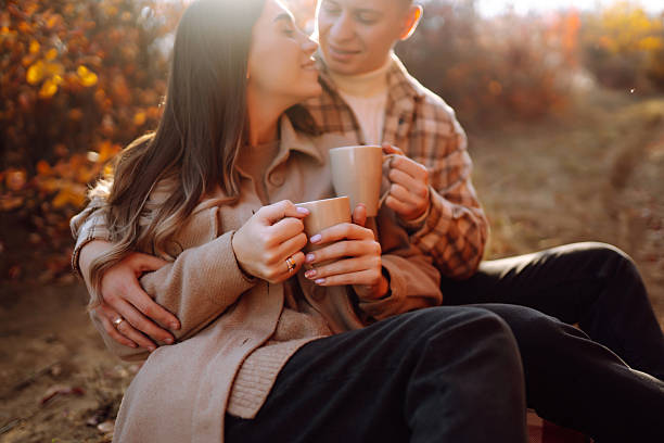 istock Two beautiful people enjoying time together in an autumn forest. 2229392473