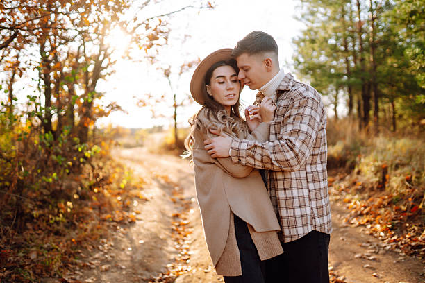 istock Two beautiful people enjoying time together in an autumn forest. 2229392498