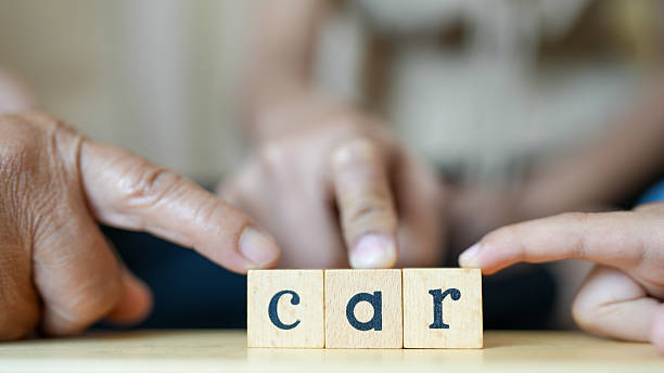 istock Learning word car can be fun and engaging experience for children, as they interact with adults using wooden blocks. This captures moment of shared learning and connection 2229396611