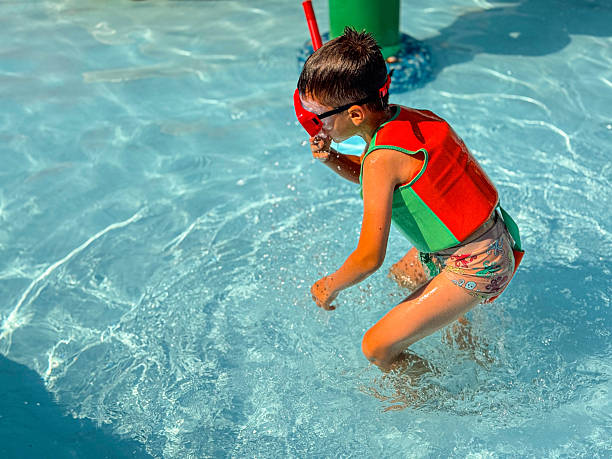 istock Boy Exploring Underwater with Snorkel and Life Vest 2229398543