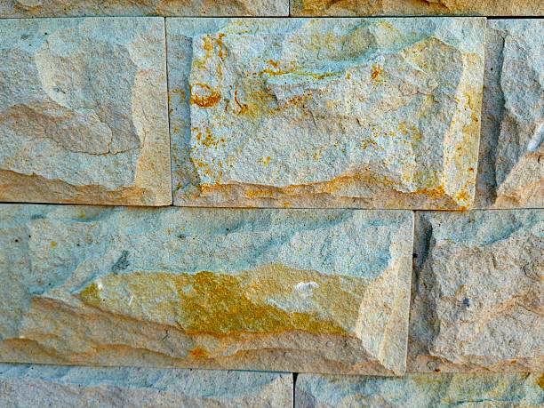 Stone wall background, close-up. Large stones surface texture for publication, poster, calendar, post, screensaver, wallpaper, cover, website. Toned high quality photography